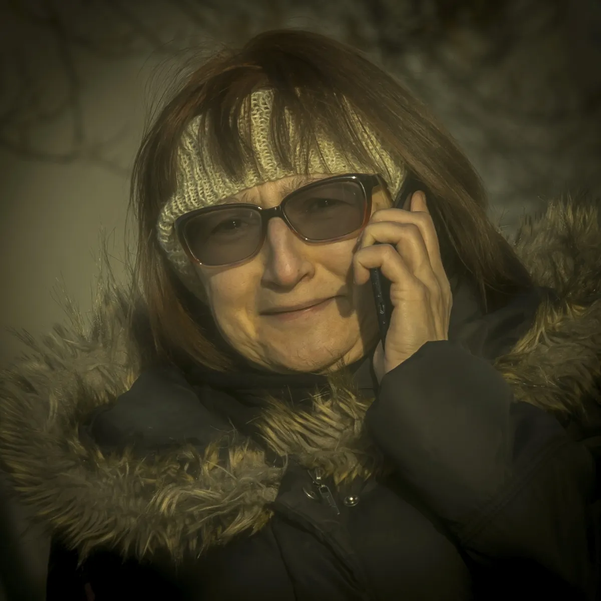 Woman in sunglasses talking on her phone
